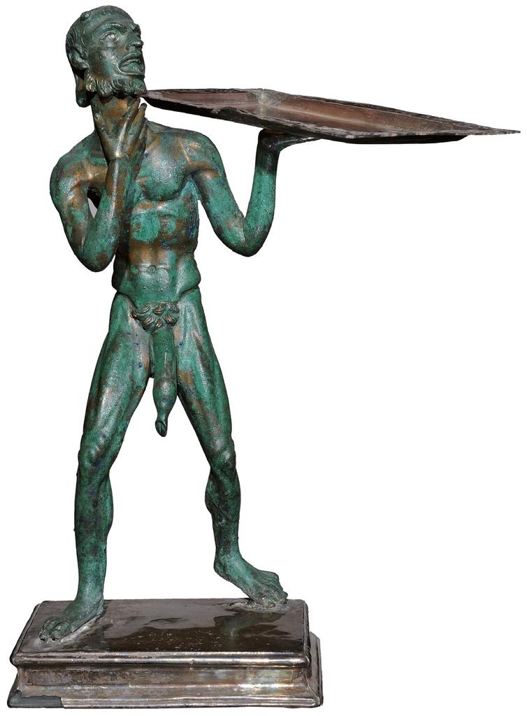 Statuette en bronze représentant un marchand de pain. Pompéi, Maison de l’Éphèbe, Iᵉʳ siècle de notre ère.